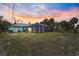 Back of home with large screened in porch at 2127 Corfell St, Port Charlotte, FL 33948