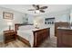 Comfortable bedroom featuring hardwood floors, modern furniture and natural lighting at 2127 Corfell St, Port Charlotte, FL 33948