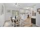 Bright dining area open to the kitchen and featuring stylish floors and sliding glass doors at 2127 Corfell St, Port Charlotte, FL 33948
