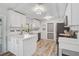 Updated kitchen featuring white cabinets, marble countertops, and stainless steel appliances at 2127 Corfell St, Port Charlotte, FL 33948