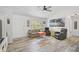 Bright living room featuring stylish flooring, comfortable seating, and ample natural light at 2127 Corfell St, Port Charlotte, FL 33948