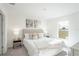 Inviting bedroom with neutral color scheme, a plush bed with decorative pillows, and modern decor at 22318 Alcorn Ave, Port Charlotte, FL 33952