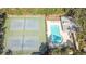 An aerial view of community tennis courts and pool with lounge chairs for sunbathing at 2809 112Th E Ter, Parrish, FL 34219