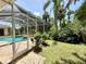 Secluded backyard pool with brick-paved patio inside screen enclosure, offering a private outdoor retreat at 2809 112Th E Ter, Parrish, FL 34219