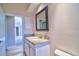 Bathroom featuring granite countertop, white cabinetry, and door to hallway at 2809 112Th E Ter, Parrish, FL 34219
