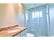 Bright bathroom with a granite countertop, white cabinets, and glass-enclosed shower at 2809 112Th E Ter, Parrish, FL 34219
