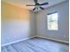 Bedroom with plank floors, light-grey walls, and a window providing natural light at 2809 112Th E Ter, Parrish, FL 34219