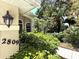 Charming home entrance with beautiful landscaping and visible address for easy identification at 2809 112Th E Ter, Parrish, FL 34219