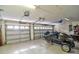 Spacious garage with multiple overhead doors offers ample parking and storage space at 2809 112Th E Ter, Parrish, FL 34219
