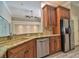 Bright kitchen with granite countertops, stainless steel appliances, and stylish cabinetry at 2809 112Th E Ter, Parrish, FL 34219