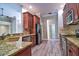 Modern kitchen featuring granite countertops, stainless steel appliances, and ample cabinet space at 2809 112Th E Ter, Parrish, FL 34219