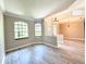Spacious living room with large windows that provide natural light, neutral walls, and modern vinyl floors at 2809 112Th E Ter, Parrish, FL 34219