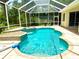Lush backyard featuring a sparkling, screened pool with lovely water features and ample space to relax at 2809 112Th E Ter, Parrish, FL 34219