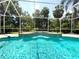 Sparkling screened pool with tile accents and cascading water features, creating a backyard oasis at 2809 112Th E Ter, Parrish, FL 34219