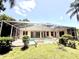 Spacious backyard featuring a screened-in pool and ample green space at 2809 112Th E Ter, Parrish, FL 34219