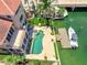Aerial view showcasing the pool, dock, and lush landscaping of this exceptional waterfront estate at 290 N Washington Dr, Sarasota, FL 34236
