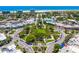 Aerial view of downtown featuring a vibrant green space, charming round-about, and surrounding streetscapes at 290 N Washington Dr, Sarasota, FL 34236