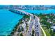 Aerial showcases a bridge and roadway with coastal views and nearby beaches, showcasing the ease of access to waterfront recreation at 290 N Washington Dr, Sarasota, FL 34236