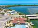 Stunning waterfront home with private dock, pool, and lush landscaping, offering direct access to the bay and Gulf beaches at 290 N Washington Dr, Sarasota, FL 34236