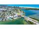 Aerial view of waterfront property with boat dock, and adjacent homes in a coastal neighborhood at 290 N Washington Dr, Sarasota, FL 34236