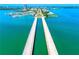 This beautiful aerial view features a long bridge in the middle of a sparkling waterway at 290 N Washington Dr, Sarasota, FL 34236