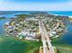 Stunning waterfront home with a private dock and lush landscaping, offering breathtaking views of the bay and coastline at 290 N Washington Dr, Sarasota, FL 34236