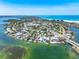 Beautiful waterfront home with a private dock and lush landscaping, offering direct access to the bay and beaches at 290 N Washington Dr, Sarasota, FL 34236