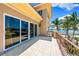 Gorgeous terrace area with sliding glass doors and beautiful views of the water at 290 N Washington Dr, Sarasota, FL 34236