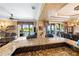 Spacious open floor plan featuring a granite bar top, a large window view, and luxury decor at 290 N Washington Dr, Sarasota, FL 34236