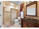 Bathroom featuring a vanity and shower with unique decor at 290 N Washington Dr, Sarasota, FL 34236