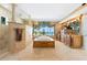 Luxurious bathroom featuring a large tub, shower, and great views of the water at 290 N Washington Dr, Sarasota, FL 34236