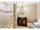 Bathroom featuring a glass-enclosed shower, vanity with marble countertop, and neutral tile at 290 N Washington Dr, Sarasota, FL 34236