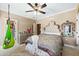 Charming bedroom features plush carpet, a decorative ceiling fan, and a hanging swing chair at 290 N Washington Dr, Sarasota, FL 34236