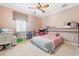 Cozy bedroom with natural light, neutral walls, and playful decor at 290 N Washington Dr, Sarasota, FL 34236