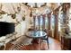 Unique room featuring many mounted animal heads, hardwood floors and custom window treatments at 290 N Washington Dr, Sarasota, FL 34236