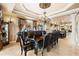 Formal dining room with large table and chairs featuring chandelier and elegant decor at 290 N Washington Dr, Sarasota, FL 34236