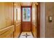 Private residential elevator with wood paneling and marble flooring for a luxurious experience at 290 N Washington Dr, Sarasota, FL 34236