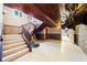 Grand entryway with marble staircase, wood paneled ceilings, and unique animal themed decor at 290 N Washington Dr, Sarasota, FL 34236