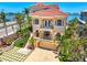 Beautiful home featuring a red tile roof, balconies, and manicured landscaping, close to the water at 290 N Washington Dr, Sarasota, FL 34236