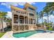 Elegant multi-story home with a private pool, spa, and outdoor kitchen, ideal for luxury living at 290 N Washington Dr, Sarasota, FL 34236
