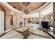 Elegant foyer with marble floors, chandelier, columns, and views of the living room at 290 N Washington Dr, Sarasota, FL 34236