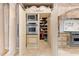 Gourmet kitchen featuring pantry, built-in microwave, oven, and stainless Viking appliances at 290 N Washington Dr, Sarasota, FL 34236