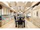 Expansive chef's kitchen with an island, stone countertops, custom cabinets, and top-of-the-line stainless steel appliances at 290 N Washington Dr, Sarasota, FL 34236