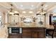 Well-appointed kitchen featuring custom island with modern appliances and breakfast bar seating at 290 N Washington Dr, Sarasota, FL 34236