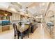 Bright chef's kitchen with center island, travertine floors, custom cabinets, and stainless appliances at 290 N Washington Dr, Sarasota, FL 34236