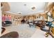 Open living room with a large area rug, and view to the kitchen and dining area at 290 N Washington Dr, Sarasota, FL 34236
