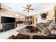 Open-concept living room with elegant furnishings, including a mounted deer head, wet bar, and marble floors at 290 N Washington Dr, Sarasota, FL 34236