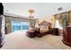 Luxurious main bedroom featuring water views, a detailed ceiling, and custom drapery at 290 N Washington Dr, Sarasota, FL 34236