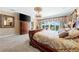 Serene main bedroom offers water views, detailed ceiling, and a cozy ambiance at 290 N Washington Dr, Sarasota, FL 34236