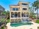 Gorgeous waterfront home with an outdoor pool, spa, and patio areas perfect for relaxing and entertaining at 290 N Washington Dr, Sarasota, FL 34236